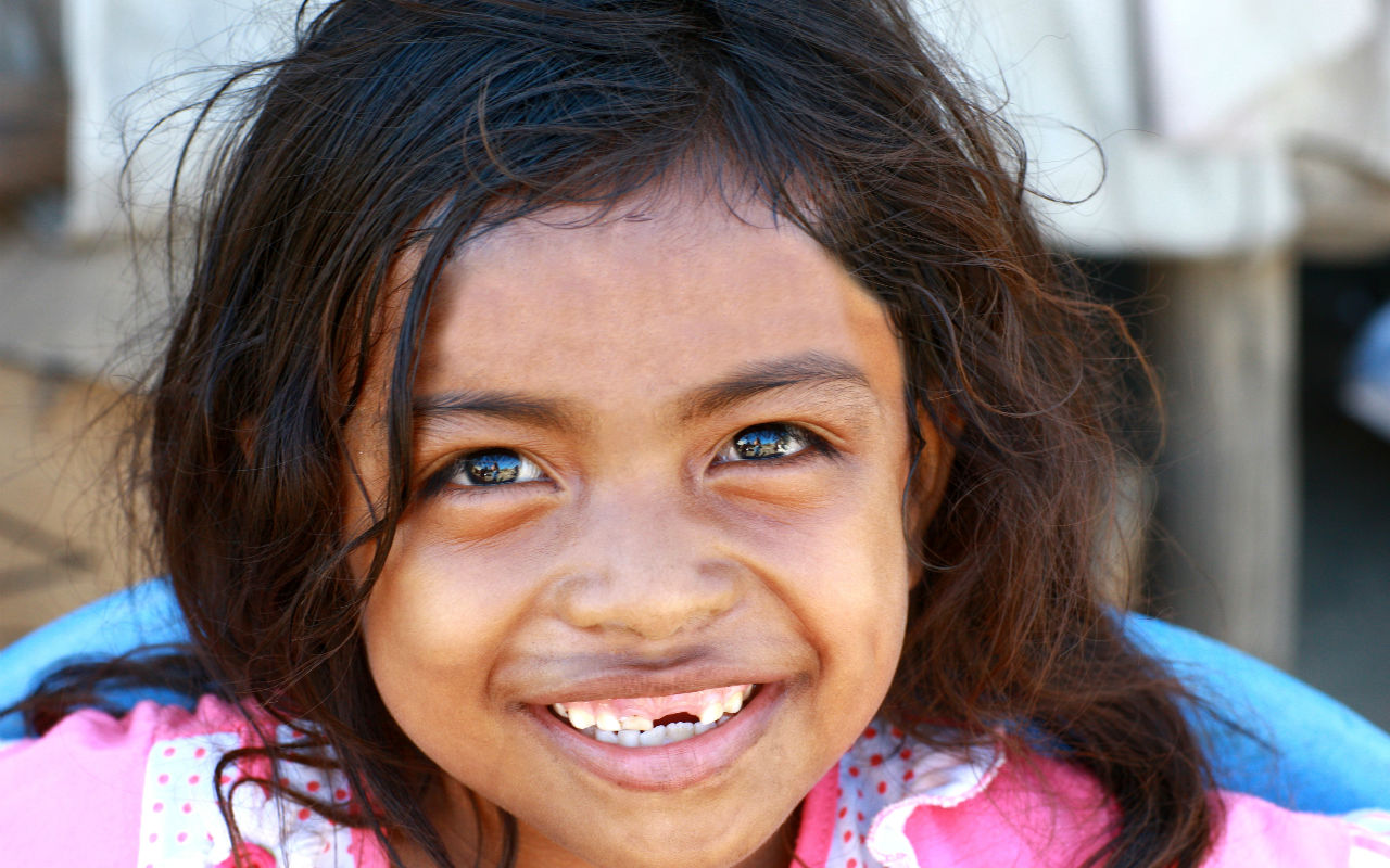 Close no sorriso de uma criança  / Crédito: UN Photo/Martine Perret